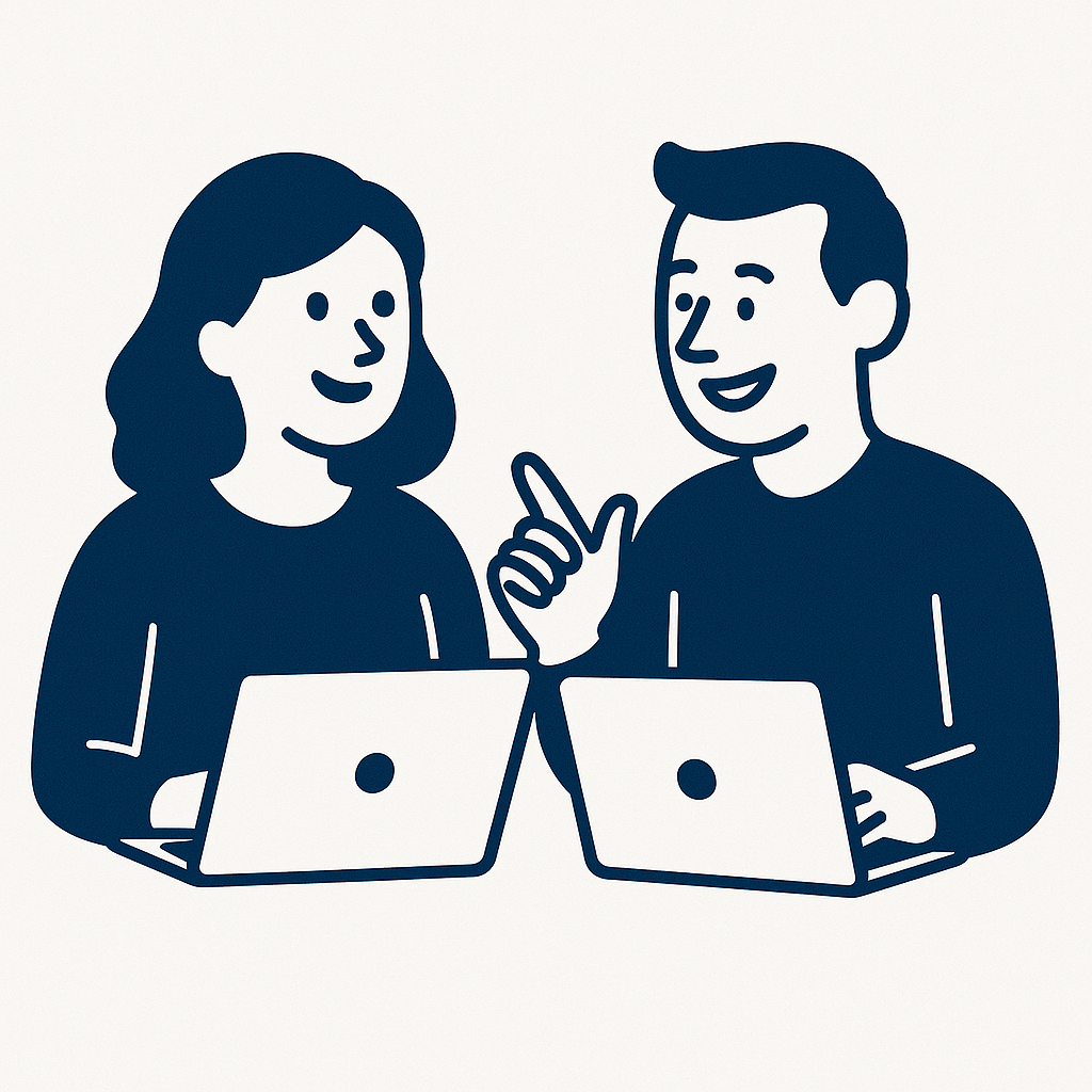 Two people, with laptops open, discussing a topic, smiling and engaged.